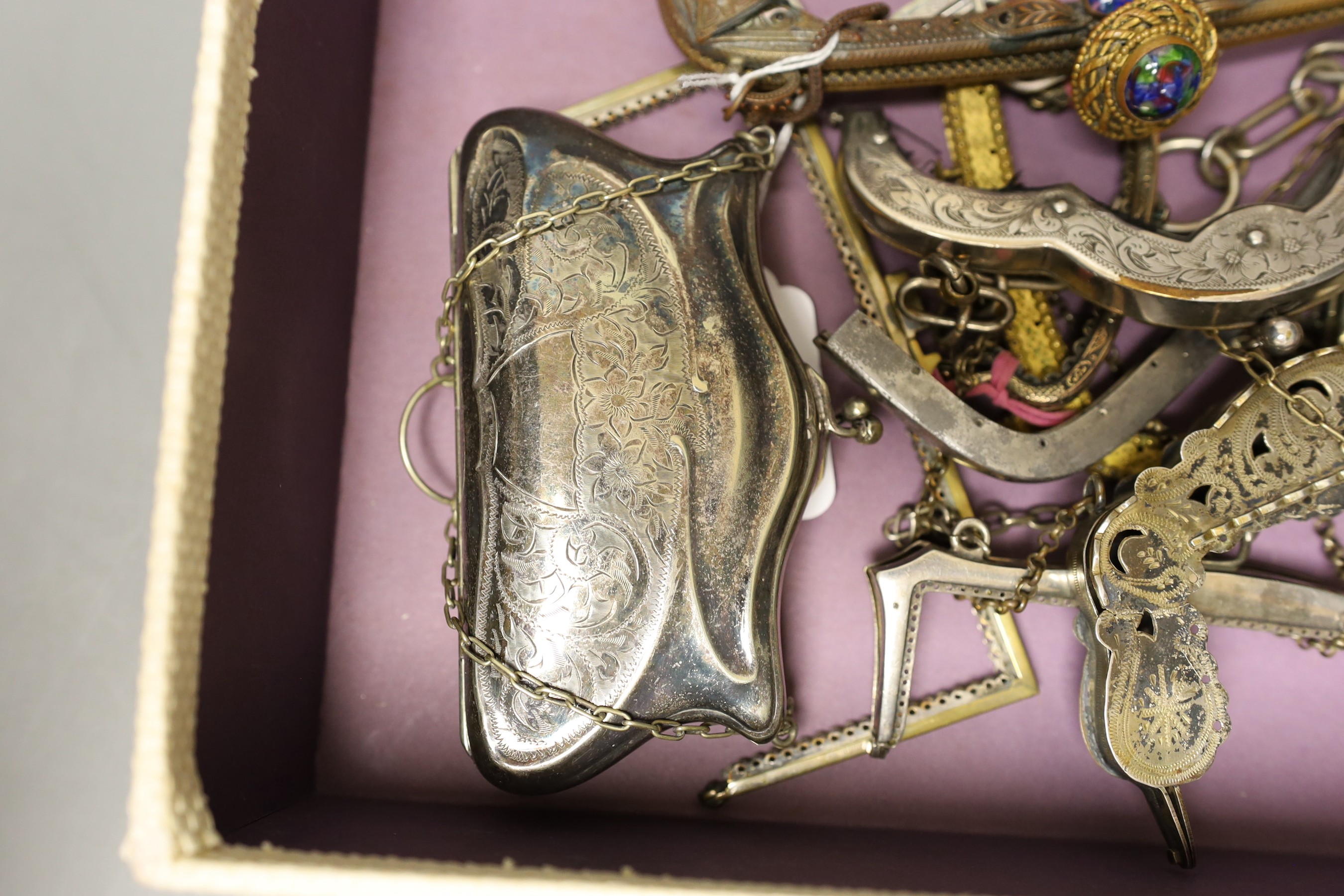 A collection of ten decorative 19th century and 20th century metal handbag frames, two Edwardian metal purses, a compact and cigarette case